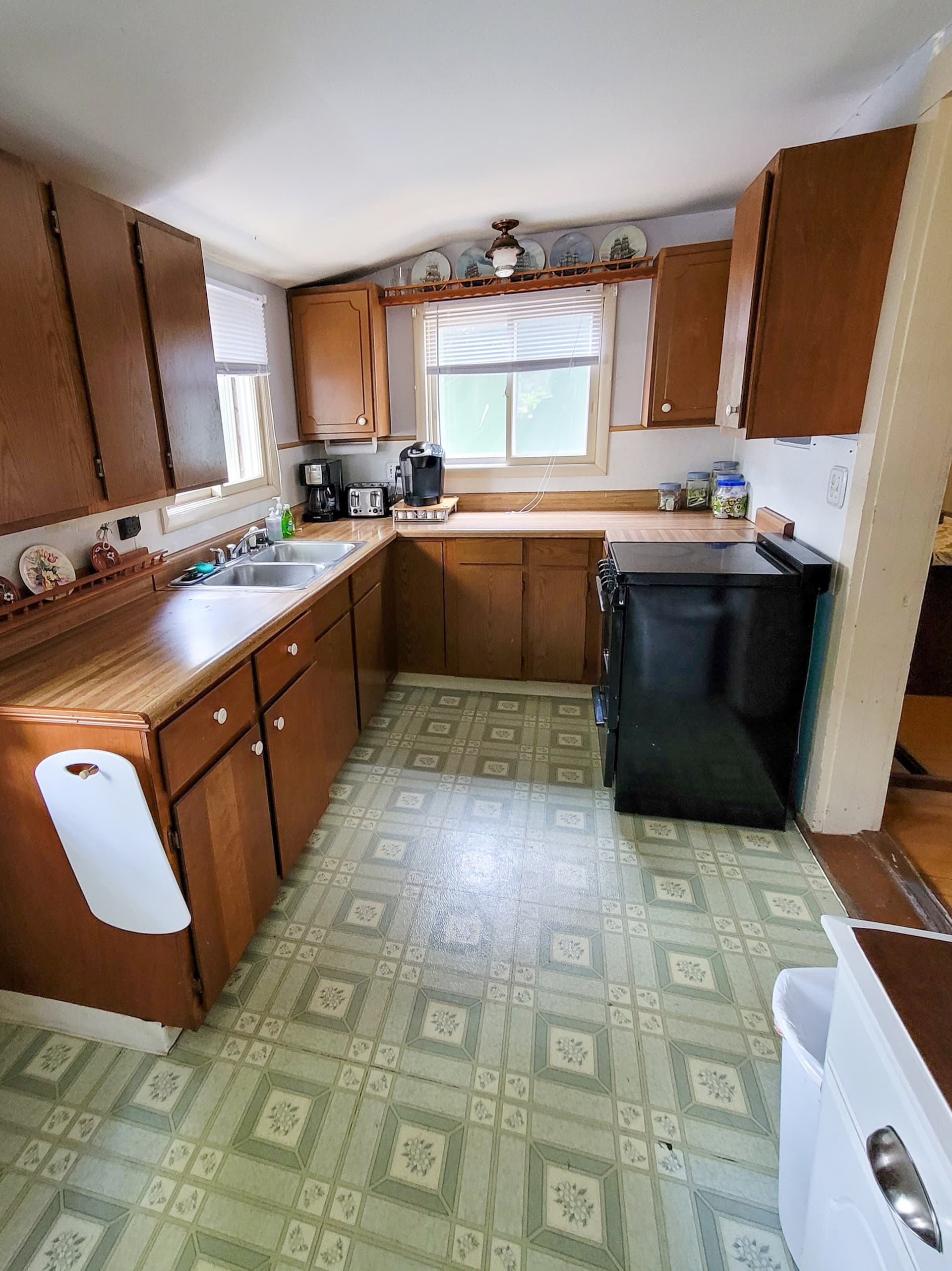 Kitchen with wood cabinets and a patterned tile floor